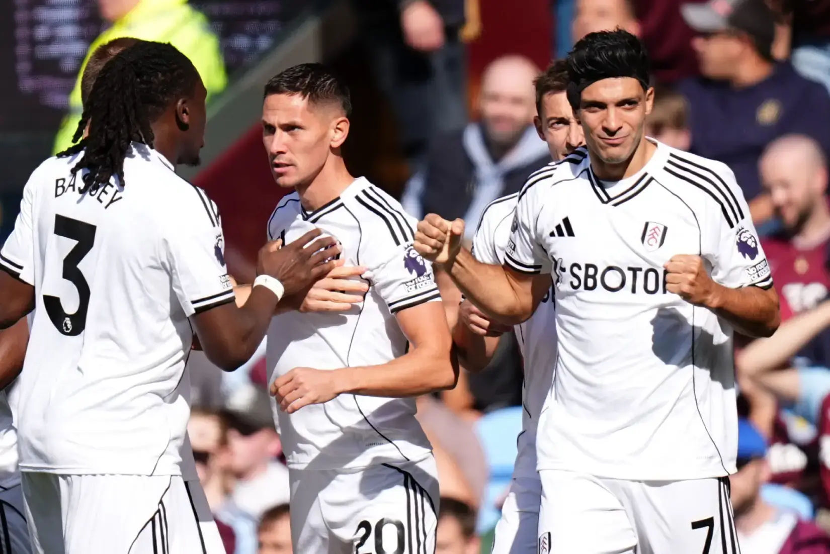 Fulham players celebrate a goal